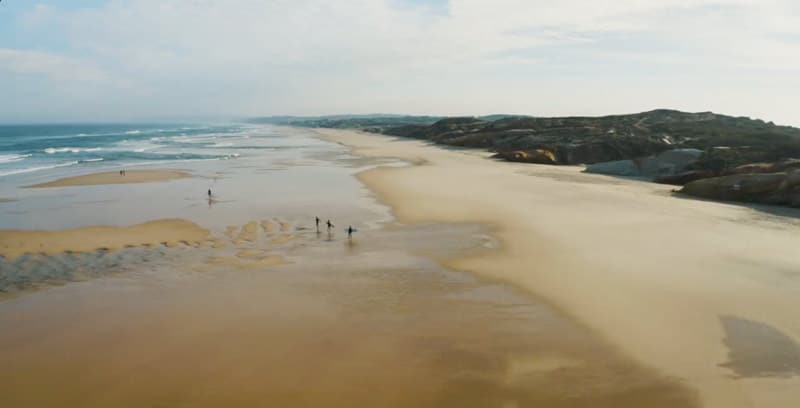 beach in peniche with surfers portugal